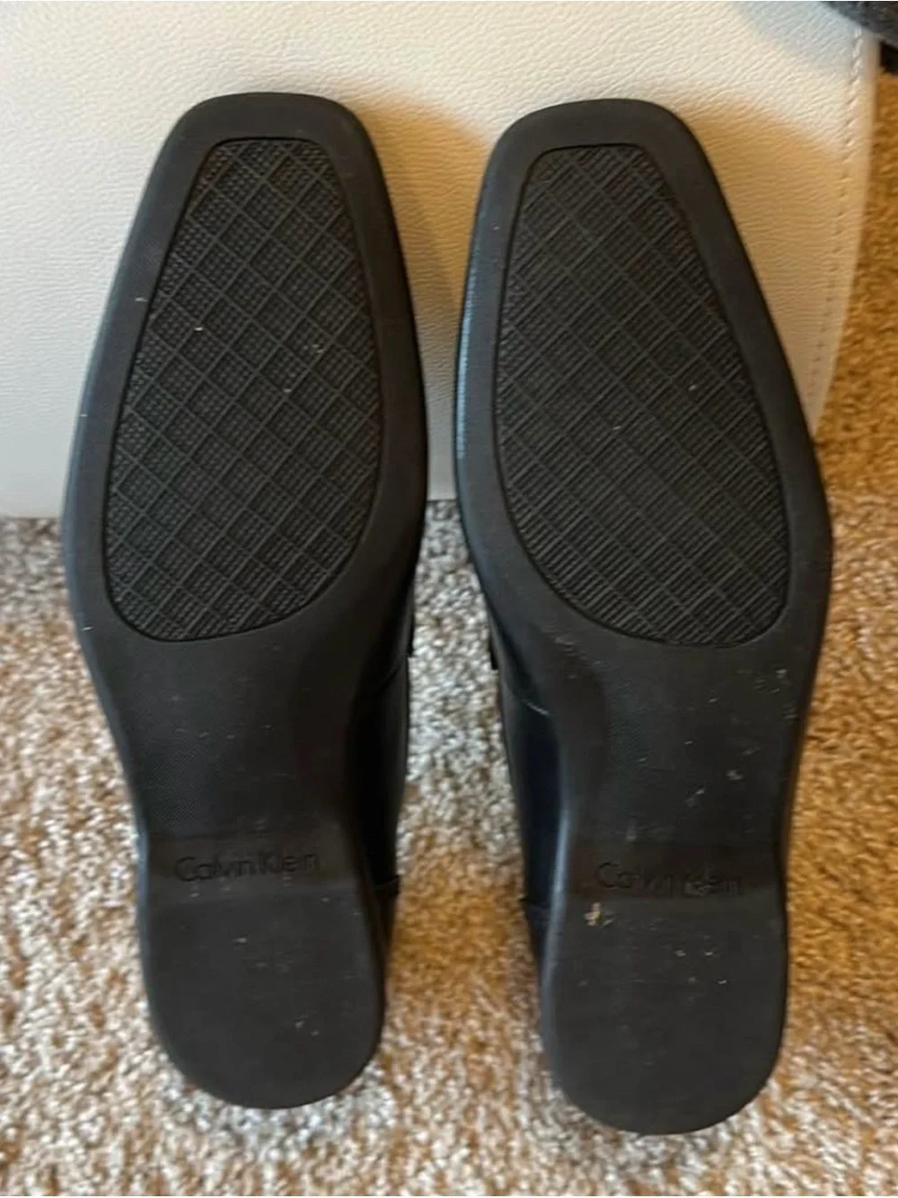 Calvin Klein Men’s Black Leather Slip-On Loafers with Metal Accent